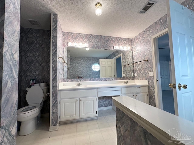 5473 Timber Creek Cir, Pace, FL 32571 - bathroom with a textured ceiling and double vanity