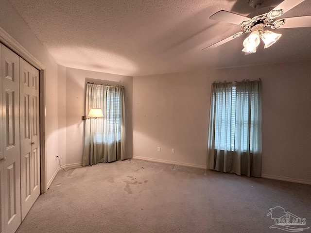5473 Timber Creek Cir, Pace, FL 32571 - empty room with carpet, a textured ceiling, and a ceiling fan