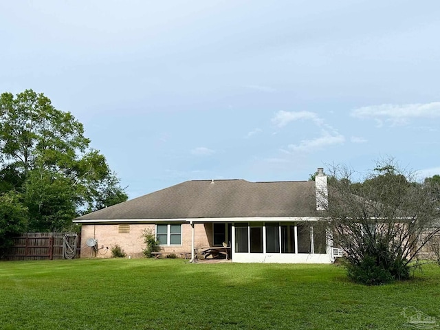 5473 Timber Creek Cir, Pace, FL 32571 - rear view of property with a chimney, a sunroom, and a shingled roof