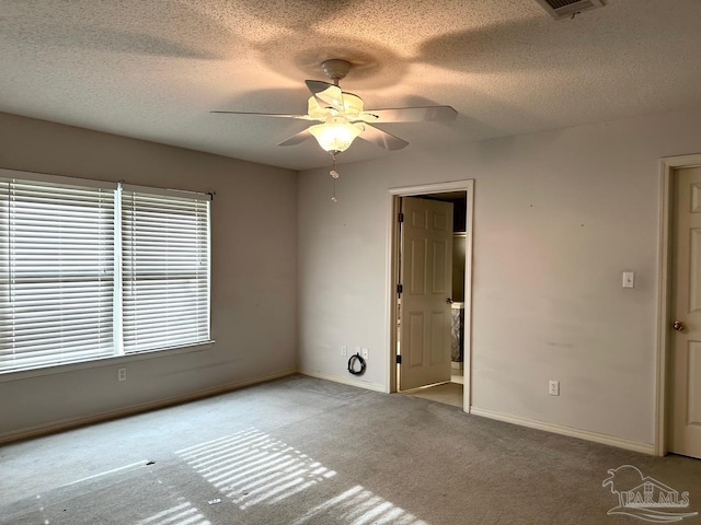 5473 Timber Creek Cir, Pace, FL 32571 - unfurnished room with a ceiling fan, carpet floors, and a textured ceiling