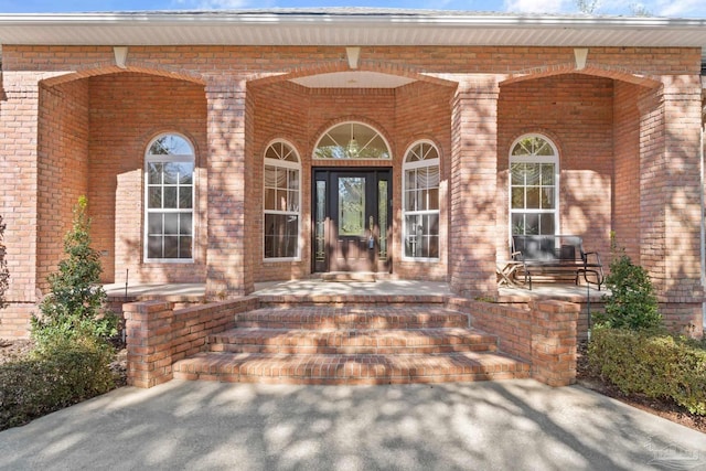 property entrance featuring a porch