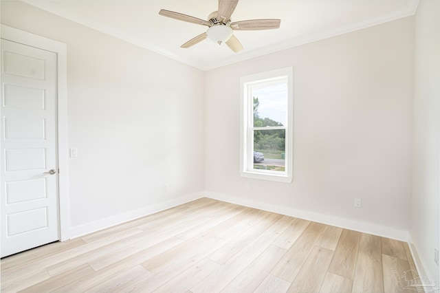 empty room featuring ceiling fan, light wood-type flooring, and ornamental molding