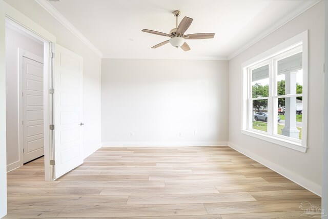 spare room with ceiling fan, crown molding, and light hardwood / wood-style floors