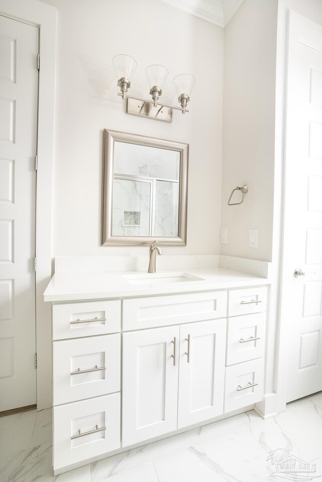 bathroom with tile patterned floors, vanity, and ornamental molding