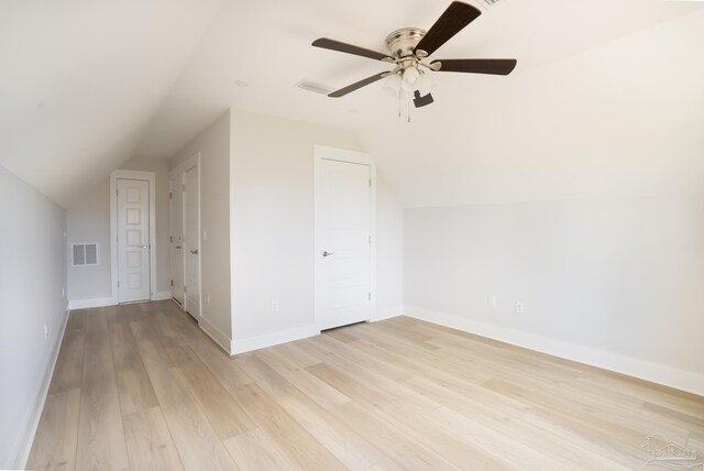 additional living space with ceiling fan, light hardwood / wood-style flooring, and lofted ceiling