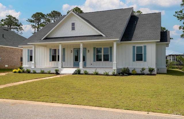 view of front of home featuring a front lawn and a porch