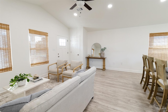 living room featuring ceiling fan, high vaulted ceiling, and light hardwood / wood-style floors