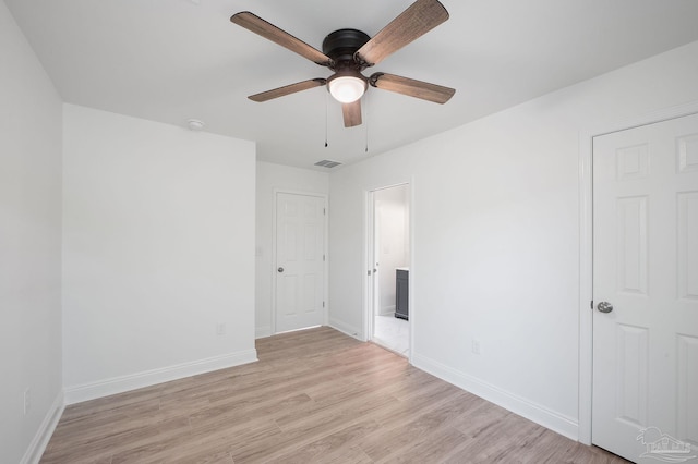 spare room featuring ceiling fan and light wood-type flooring