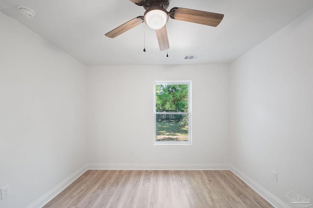 empty room featuring ceiling fan and light hardwood / wood-style floors