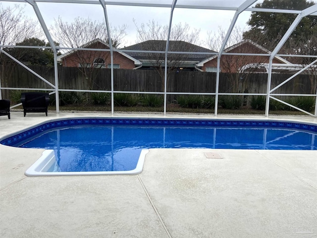 view of pool with a lanai and a patio area