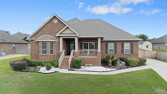 2167 Paddlewheel Way, Cantonment, FL 32533 - view of front of home featuring brick siding, a shingled roof, and central air condition unit