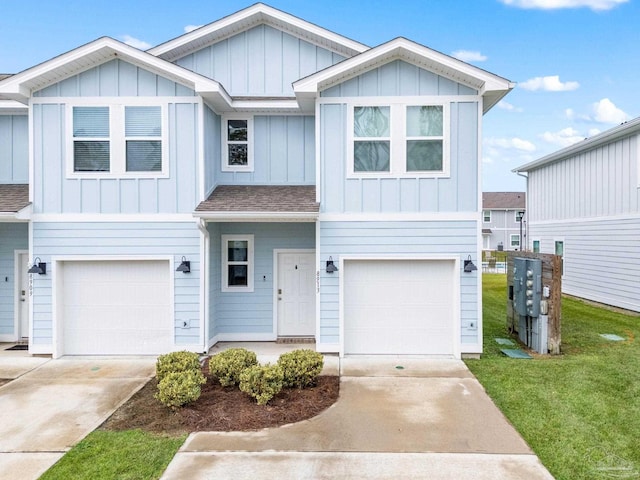 view of front of house with a garage and a front yard