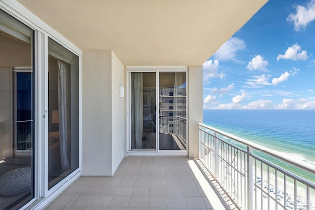 balcony with a view of the beach and a water view