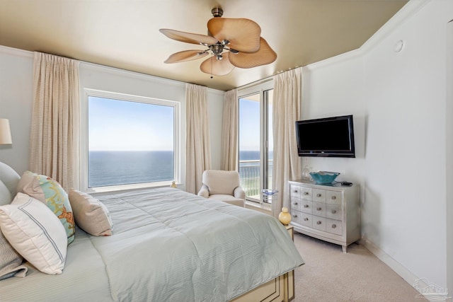 bedroom with multiple windows, light carpet, access to exterior, and ceiling fan