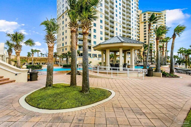 view of swimming pool featuring a water view