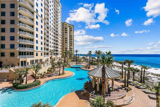 view of pool featuring a gazebo and a water view