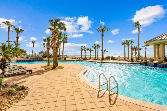 view of swimming pool featuring a patio area