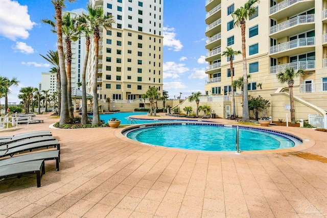 view of pool featuring a patio area