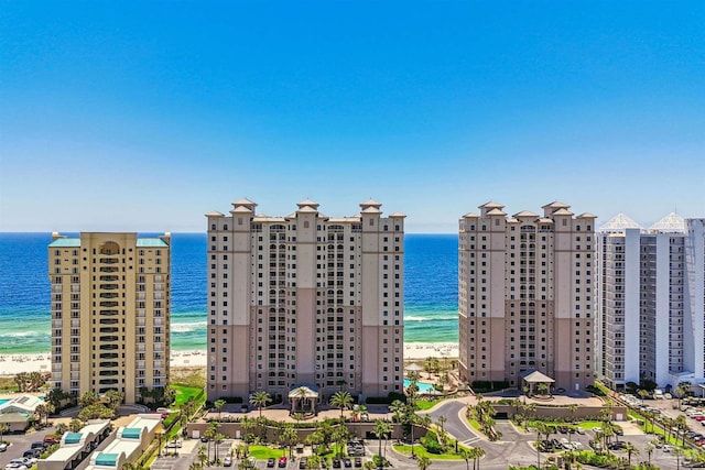 drone / aerial view with a beach view and a water view