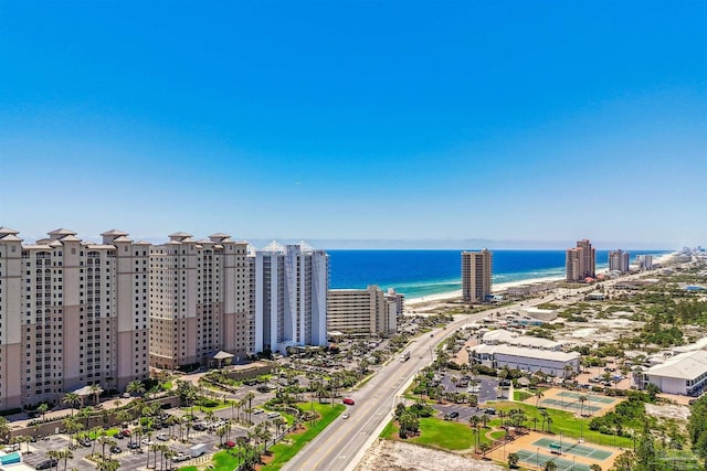 drone / aerial view featuring a water view and a beach view