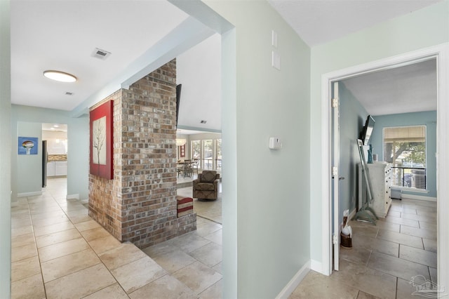 corridor with light tile patterned flooring