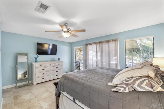 bedroom with ceiling fan and light tile patterned floors