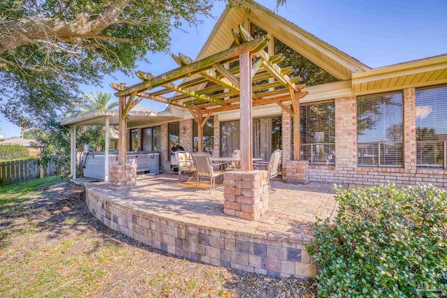 view of patio / terrace with a pergola and a hot tub