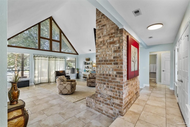 hall featuring high vaulted ceiling