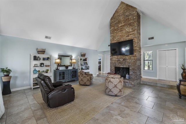 living room with a fireplace and high vaulted ceiling