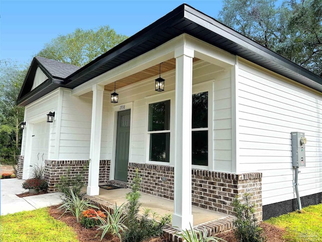 exterior space with a garage and a porch