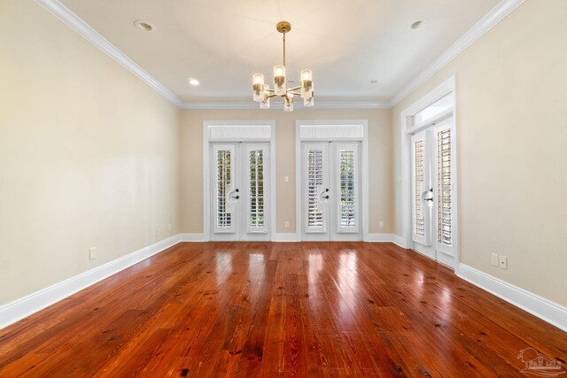 3869 Paradise Bay Dr, Gulf Breeze, FL 32563 - unfurnished room with a chandelier, hardwood / wood-style flooring, crown molding, baseboards, and recessed lighting