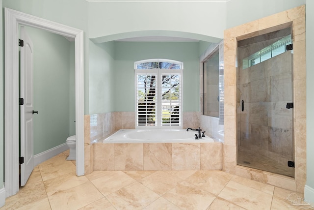 3869 Paradise Bay Dr, Gulf Breeze, FL 32563 - bathroom featuring a garden tub, toilet, a stall shower, and tile patterned flooring