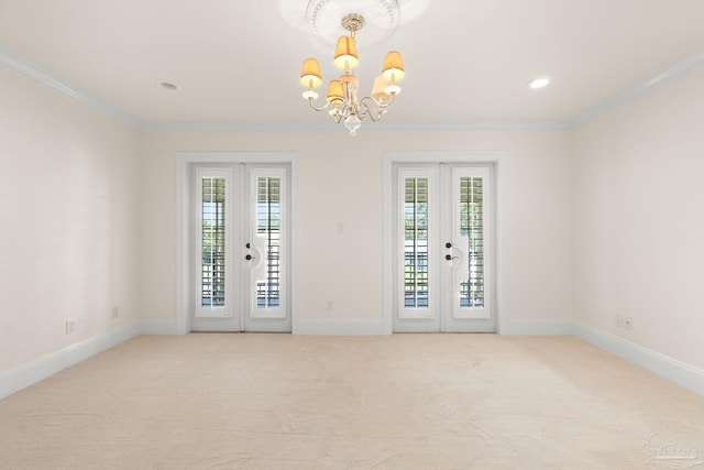 3869 Paradise Bay Dr, Gulf Breeze, FL 32563 - unfurnished room featuring ornamental molding, a chandelier, baseboards, light colored carpet, and french doors