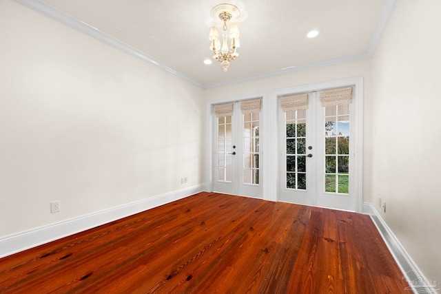 3869 Paradise Bay Dr, Gulf Breeze, FL 32563 - spare room with a chandelier, ornamental molding, baseboards, wood finished floors, and french doors