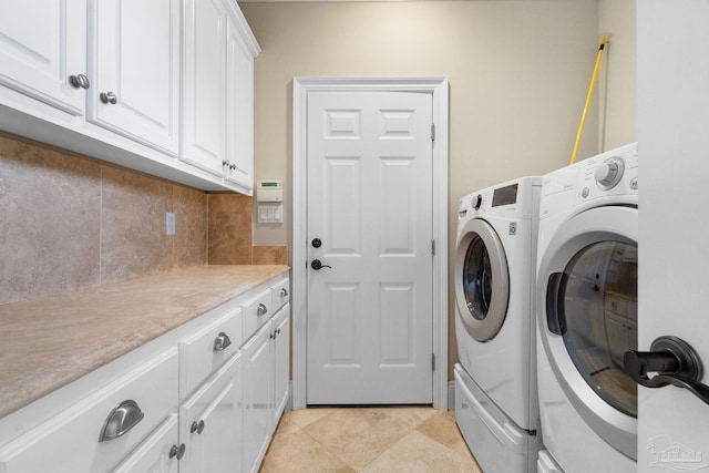 3869 Paradise Bay Dr, Gulf Breeze, FL 32563 - laundry area with washing machine and clothes dryer and cabinet space