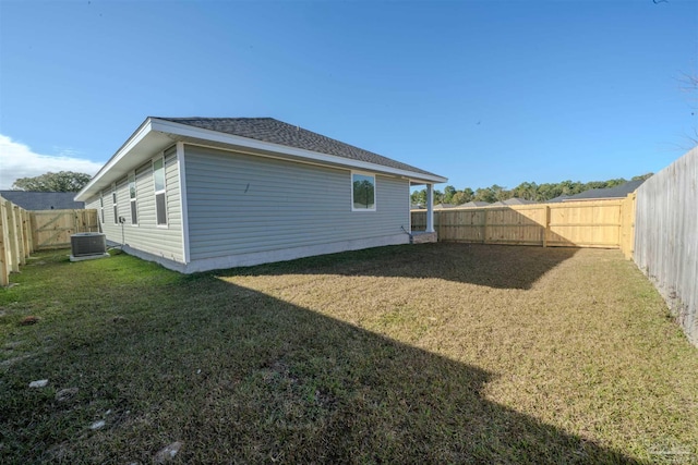 view of property exterior featuring a yard and central AC