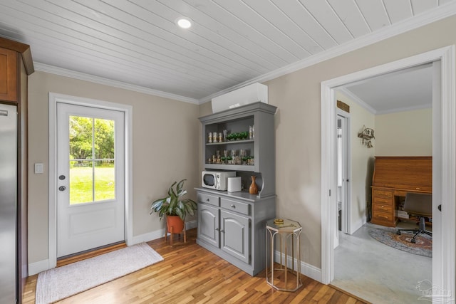 doorway with baseboards, ornamental molding, wood ceiling, and light wood finished floors