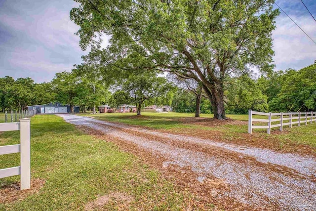 view of road featuring gravel driveway