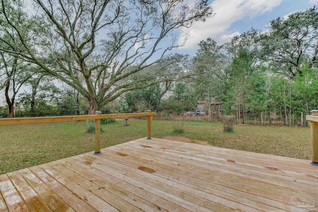 deck featuring a lawn