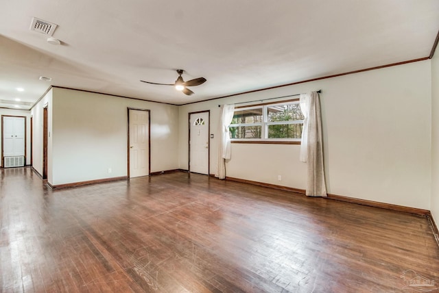 empty room featuring visible vents, baseboards, ceiling fan, and wood finished floors