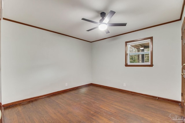 unfurnished room with crown molding, a ceiling fan, baseboards, and wood finished floors