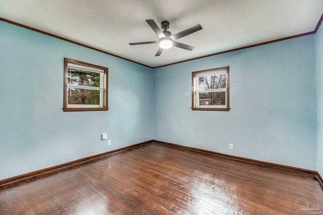 empty room featuring a ceiling fan, hardwood / wood-style flooring, baseboards, ornamental molding, and a textured wall