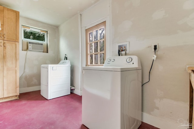 clothes washing area featuring washer and dryer, baseboards, cooling unit, carpet flooring, and cabinet space
