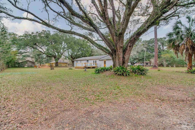 view of yard with a deck