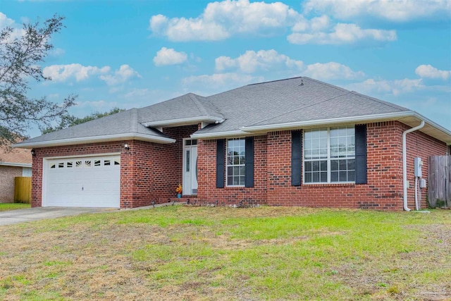 ranch-style home featuring a garage and a front lawn