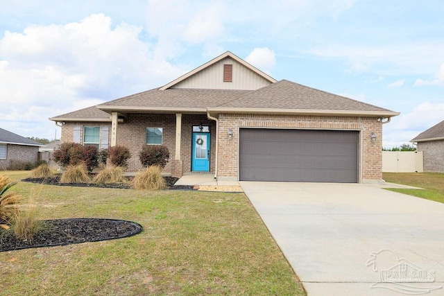 ranch-style home with a garage, concrete driveway, a front lawn, and brick siding