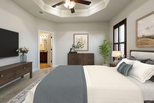 bedroom with visible vents, a raised ceiling, light colored carpet, ensuite bath, and crown molding