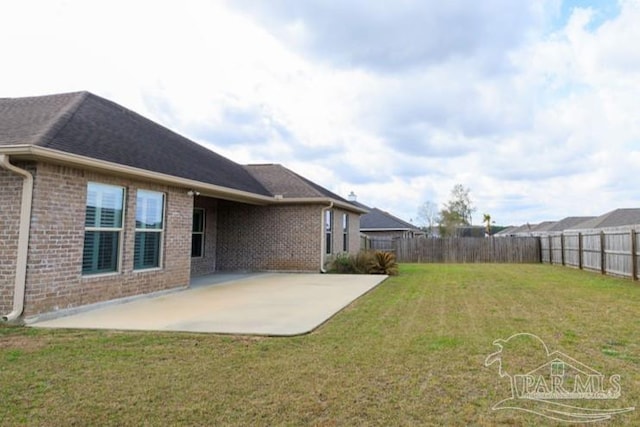 view of yard with a fenced backyard and a patio