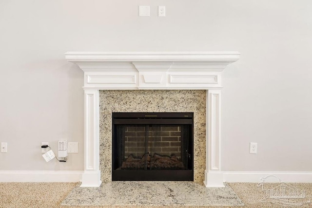 details with a premium fireplace and baseboards