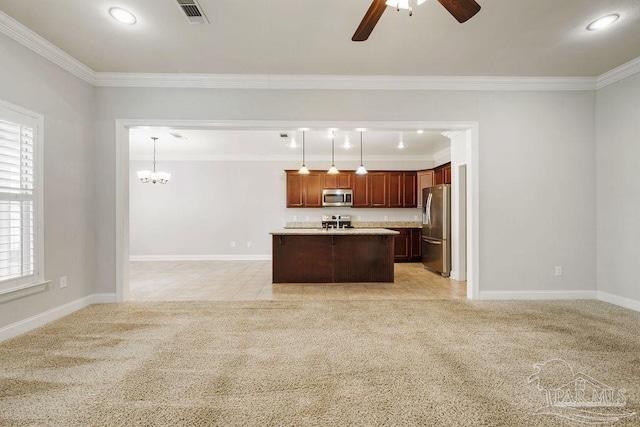 kitchen featuring appliances with stainless steel finishes, open floor plan, light colored carpet, and visible vents